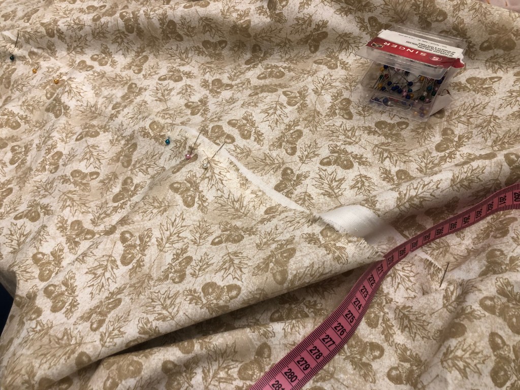 Fabric with a winter holiday theme (Pine Cones)