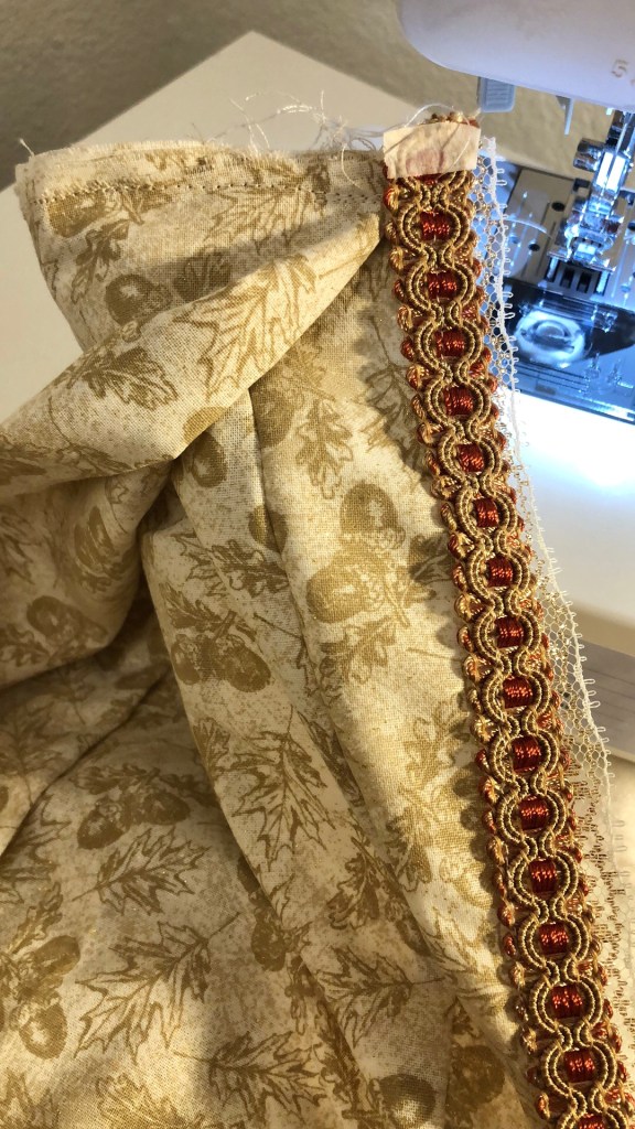 Sewing trim on top of the fabric